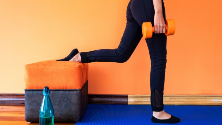 person at home performing single-leg exercise